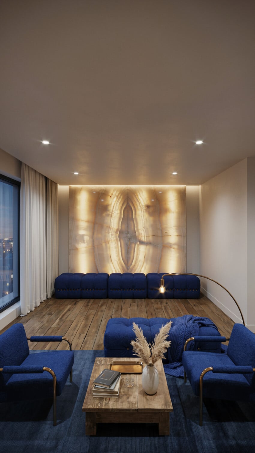 Backlit Onyx Accent Wall with Navy Seating and Brass Accents