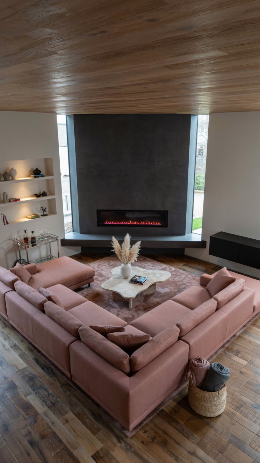 Corner Fireplace Design with Charcoal Microcement