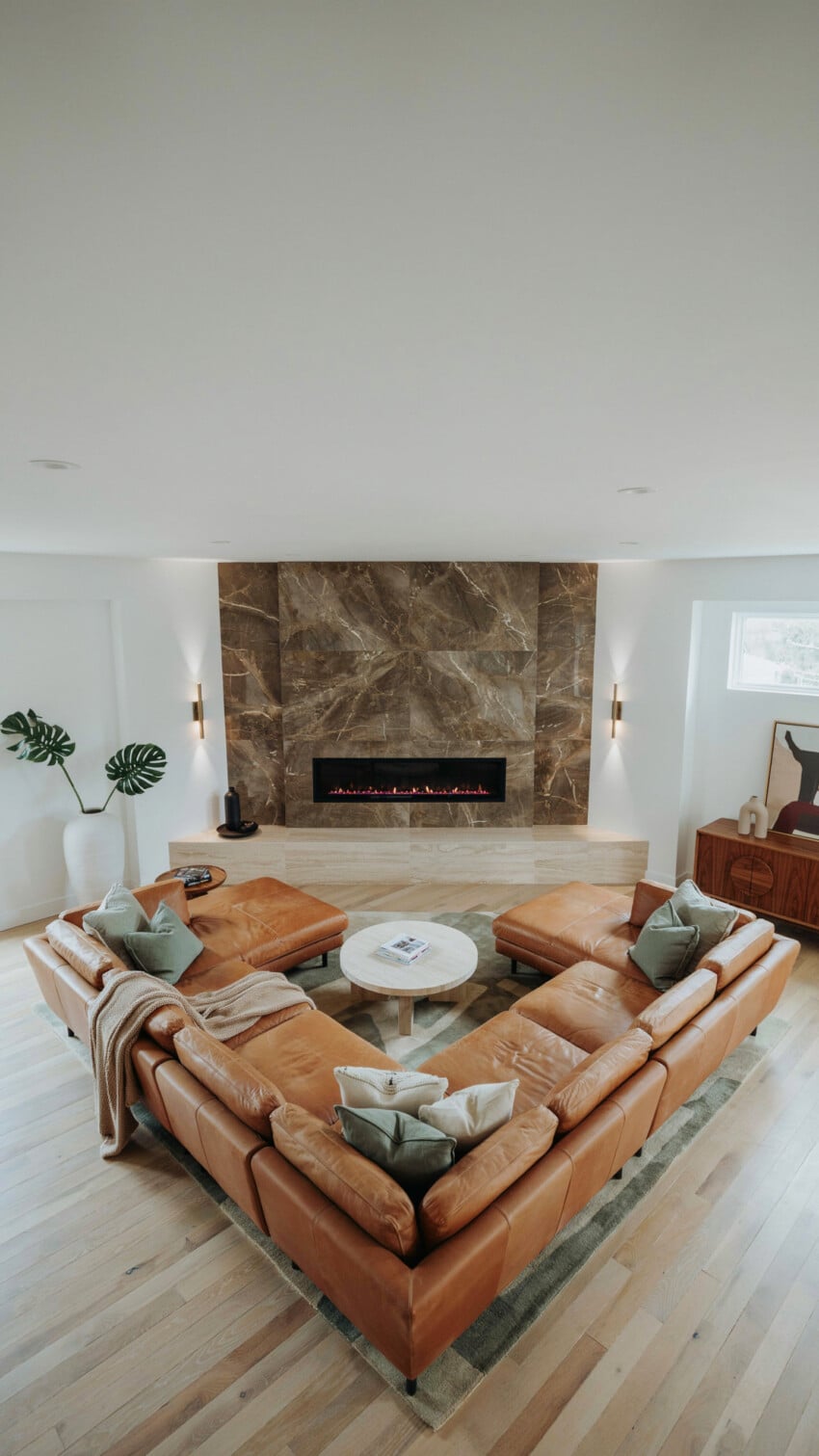 Corner Fireplace Design with Gold-Veined Chocolate Brown Marble-Look Tile Surround
