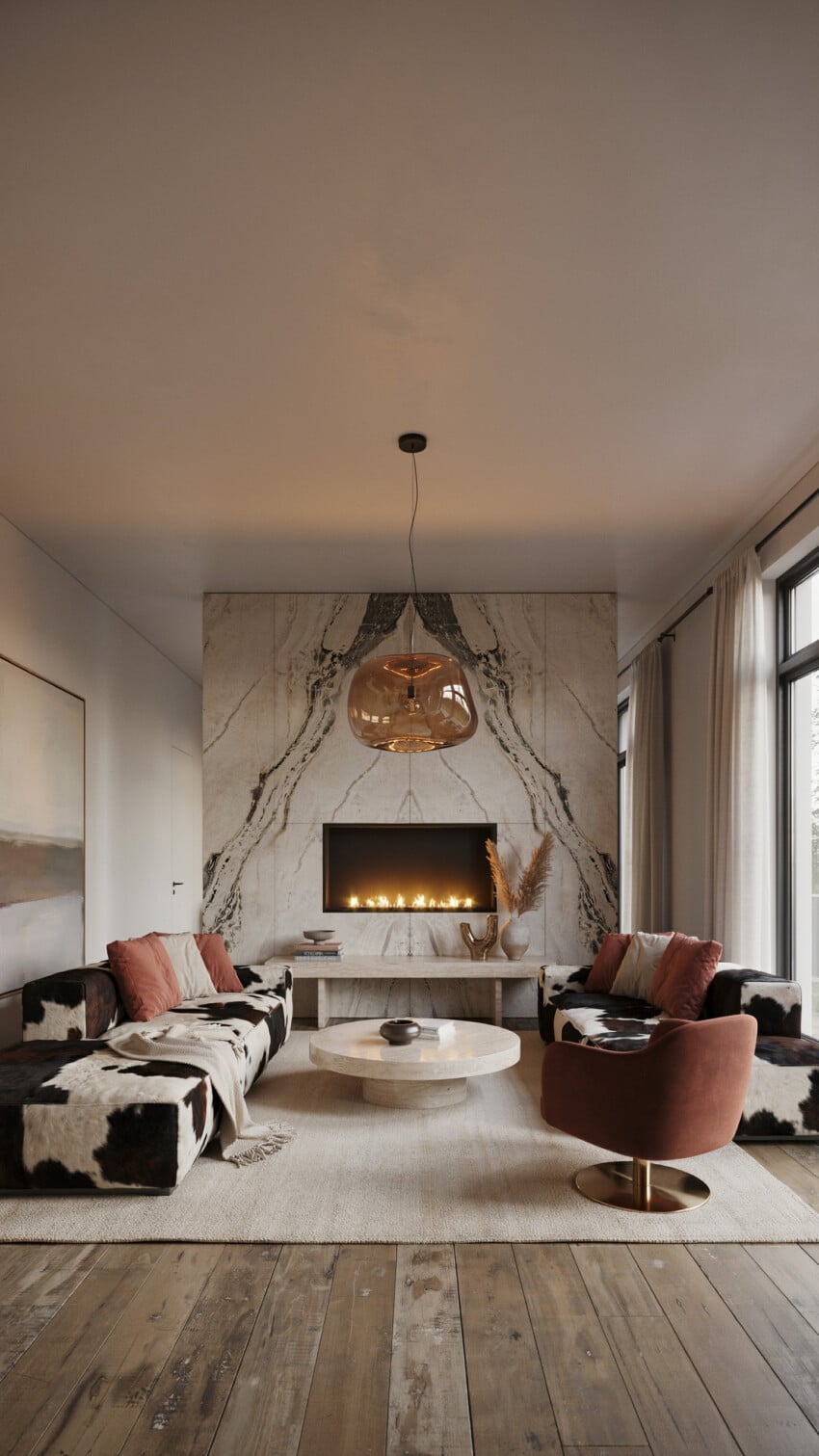 Bookmatched Marble Accent Wall with Cowhide Sofas and Terracotta Swivel Chair
