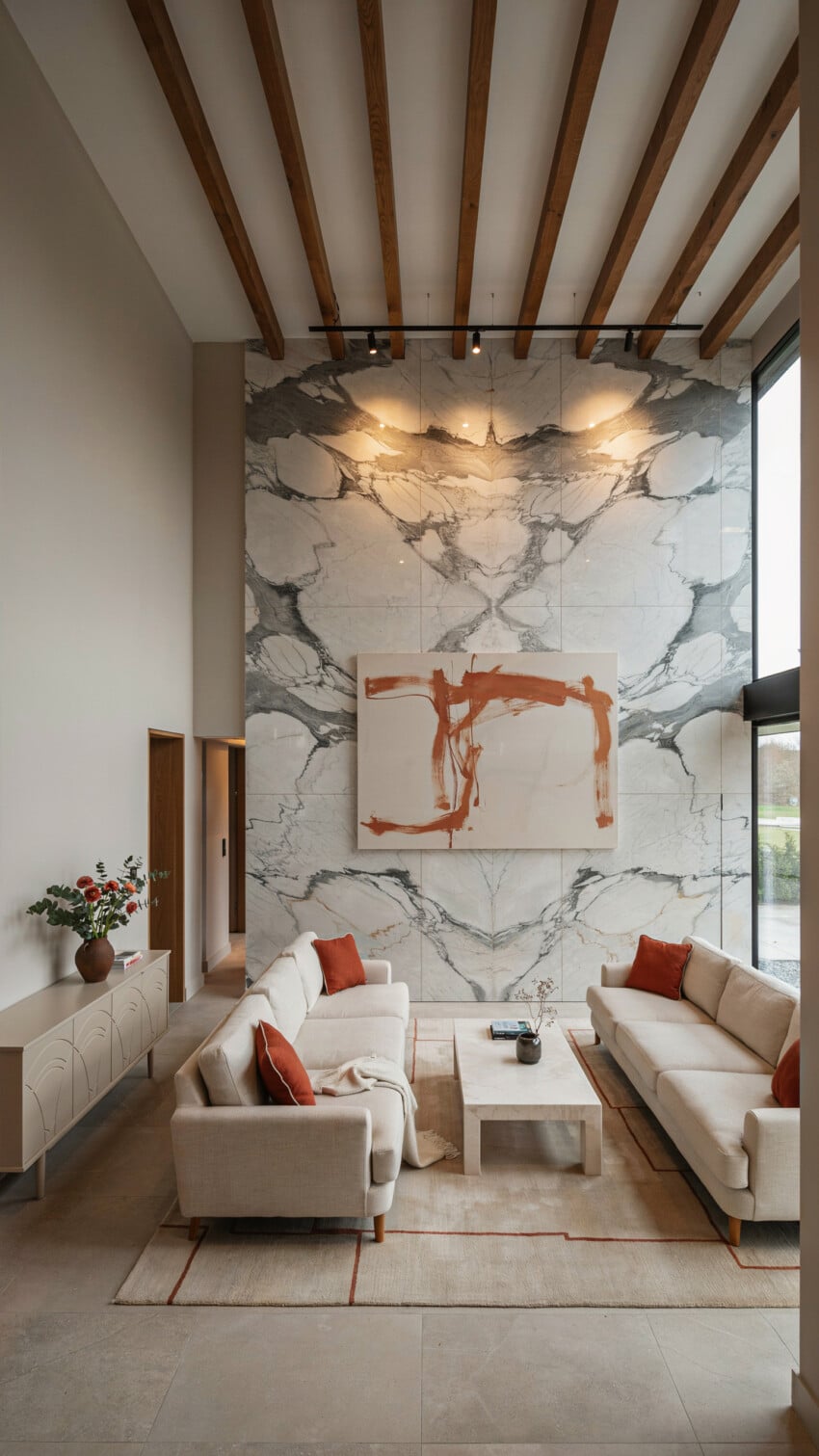 Bookmatched Marble Accent Wall with Cream Linen Sofas and Abstract Art
