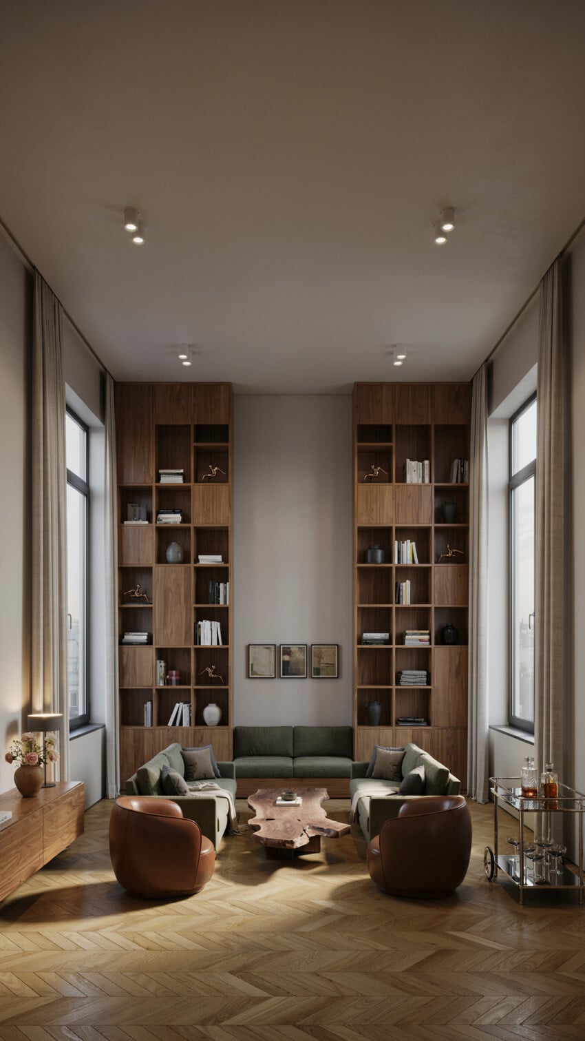 Walnut Built-In Bookcase Accent Wall with Sage Sofas and Cognac Swivel Chairs
