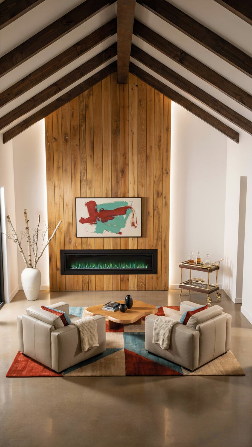 Knotty Pine Shiplap Accent Wall with Cream Swivel Chairs and Exposed Beam Vaulted Ceiling
